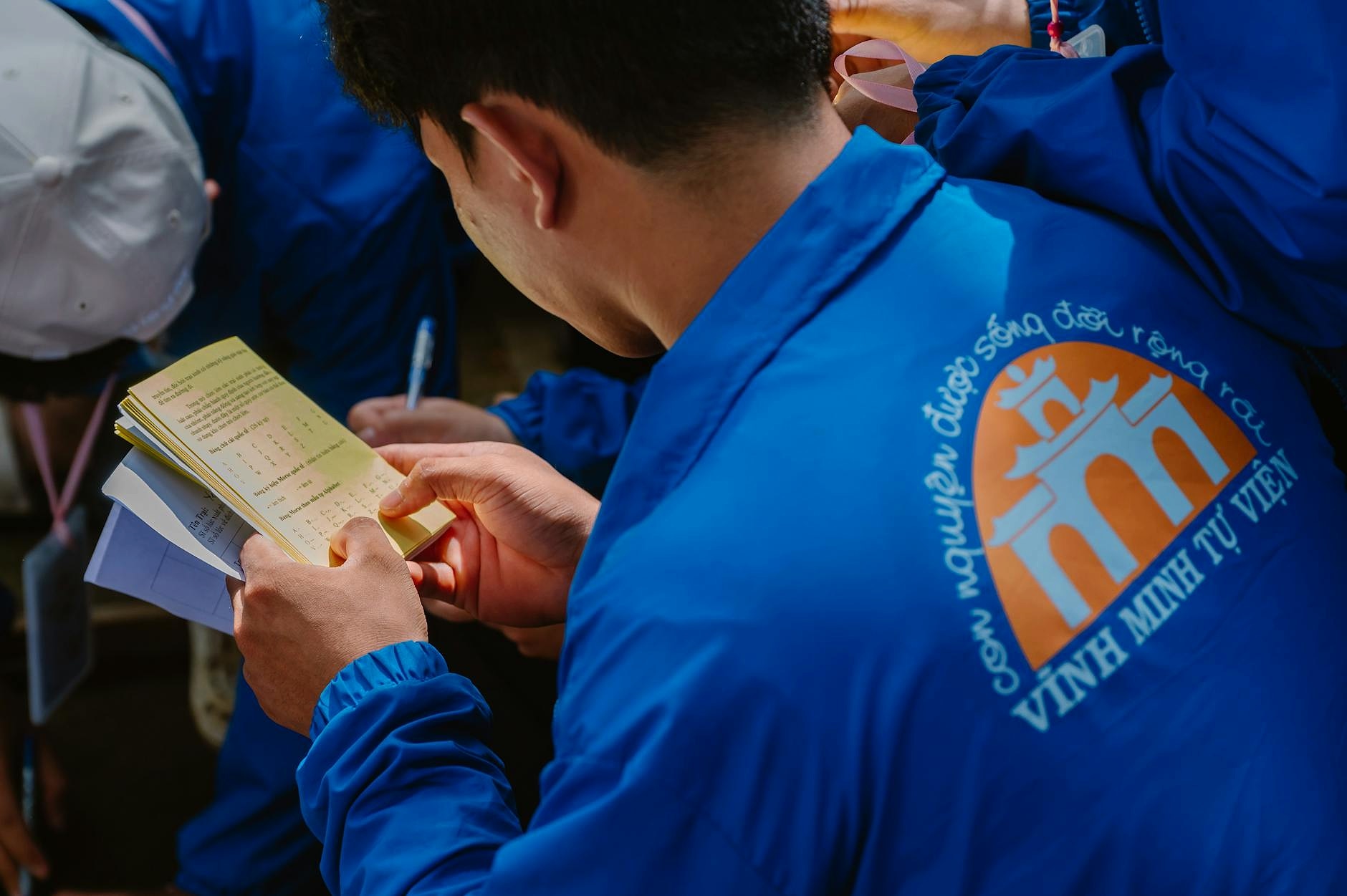Community volunteer reviewing budget documents at a meeting